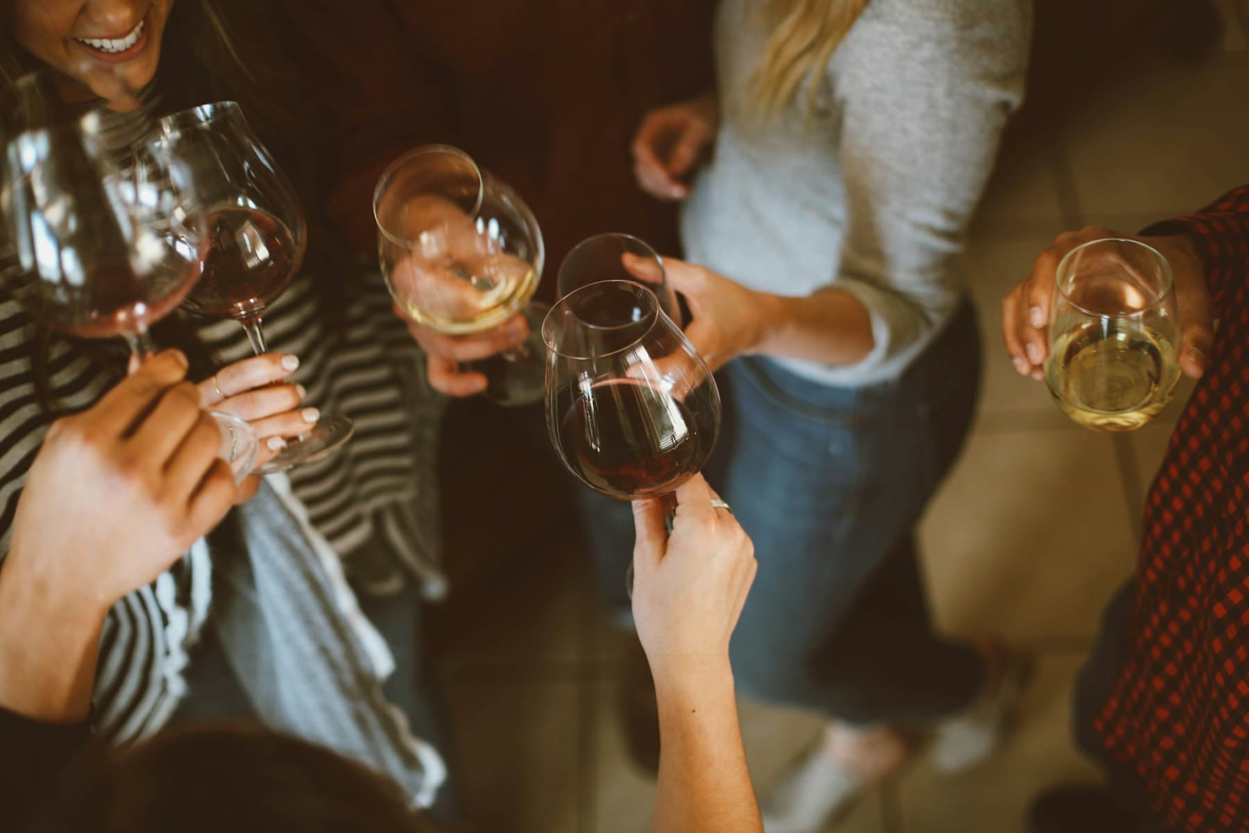 Wine glasses raised during a private celebration dinner